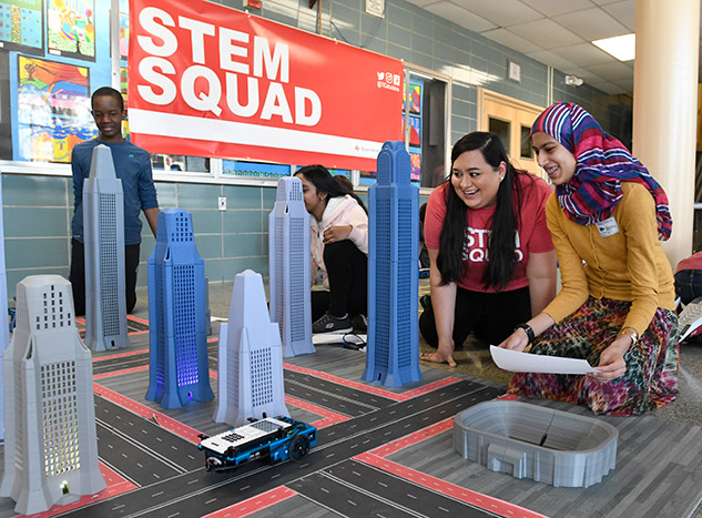 Students move the TI-Innovator™ Rover through tall buildings.